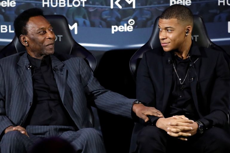 French soccer player Kylian Mbappe and Brazilian soccer legend Pele pose ahead of their meeting in Paris, France April 2, 2019. REUTERS/Christian Hartmann