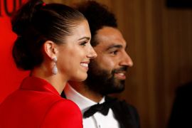U.S. soccer player Alex Morgan poses with Liverpool's Mohamed Salah as they arrive for the Time 100 Gala celebrating Time magazine's 100 most influential people in the world in New York, U.S., April 23, 2019. REUTERS/Andrew Kelly