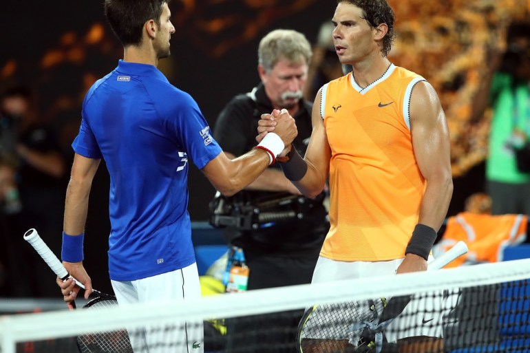 MELBOURNE, AUSTRALIA - JANUARY 27: Novak Djokovic of Serbia is congratulated in his Men's Singles Final match by Rafael Nadal of Spain during day 14 of the 2019 Australian Open at Melbourne Park on January 27, 2019 in Melbourne, Australia. (Photo by Julian Finney/Getty Images)