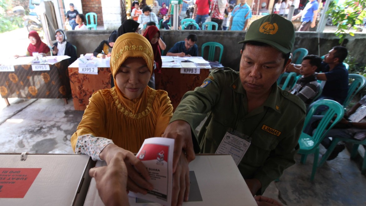 Disabled voters cast vote at designated disable polling booths- - PALEMBANG, INDONESIA - APRIL 17: Indonesian visually impaired person casts her vote during the general election at polling station in Palembang, Indonesia on April 17, 2019. Indonesians people cast their votes to elect the president, vice president and members of the House of Representatives as well as Regional Representative Council.