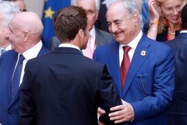 Khalifa Haftar, the military commander who dominates eastern Libya, shakes hands with French President Emmanuel Macron after the participants of the International Conference on Libya listened to a verbal agreement between the various parties regarding the organization of a democratic election this year at the Elysee Palace in Paris, France, May 29, 2018. Etienne Laurent/Pool via Reuters