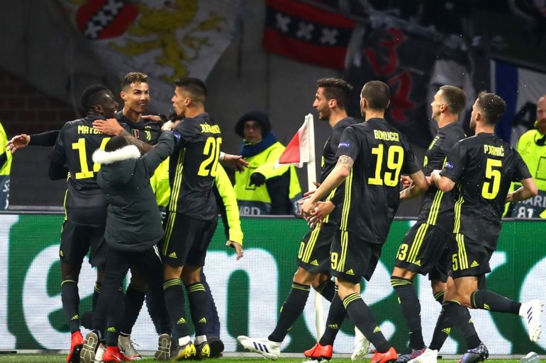 AMSTERDAM, NETHERLANDS - APRIL 10: Cristiano Ronaldo of Juventus celebrates with teammates after scoring his team's first goal during the UEFA Champions League Quarter Final first leg match between Ajax and Juventus at Johan Cruyff Arena on April 10, 2019 in Amsterdam, Netherlands. (Photo by Lars Baron/Getty Images)