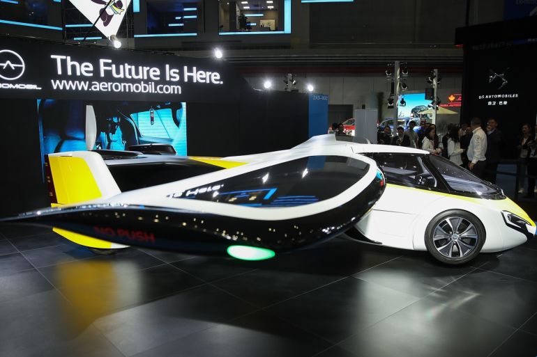 SHANGHAI, CHINA - NOVEMBER 05: A flying car made form AeroMobil display at the first China International Import Expo (CIIE) at the National Exhibition and Convention Centre on November 5, 2018 in Shanghai, China. The first China International Import Expo will be held on November 5-10 in Shanghai. (Photo by Lintao Zhang/Getty Images)