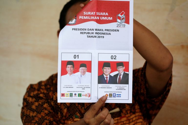 A person holds up a voting ballot during the counting of the Indonesian elections results in Jakarta Indonesia April 17 2019. REUTERS/Willy Kurniawan