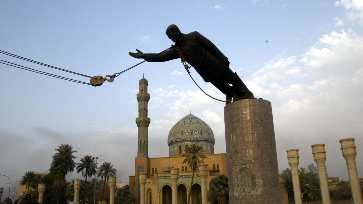 A statue of Iraq's President Saddam Hussein falls as it is pulled down incentral Baghdad April 9, 2003. U.S. troops pulled down a 20-foot (six metre)high statue of President Saddam Hussein in central Baghdad on Wednesday andIraqis danced on it in contempt for the man who ruled them with an iron gripfor 24 years. In scenes reminiscent of the fall of the Berlin Wall in 1989,Iraqis earlier took a sledgehammer to the marble plinth under the statue ofSaddam. Youths had placed a noose around the statue's neck and attached therope to a U.S. armoured recovery vehicle.    PP03040026      REUTERS/GoranTomasevicGOT