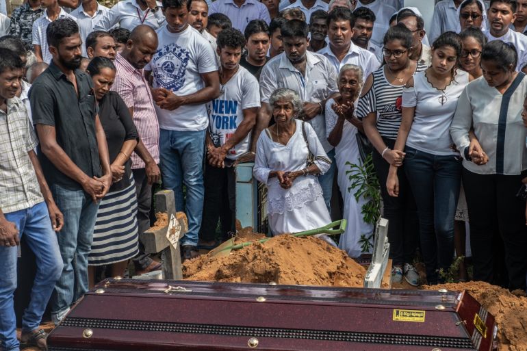 NEGOMBO, SRI LANKA - APRIL 25: People attend the funeral of a husband and wife who were killed in the Easter Sunday attack on St Sebastian's Church, on April 25, 2019 in Negombo, Sri Lanka. At least 359 people were killed and 500 people injured after coordinated attacks on churches and hotels on Easter Sunday which rocked three churches and three luxury hotels in and around Colombo as well as at Batticaloa in Sri Lanka. According to reports, police have identified eight out of nine attackers on Wednesday as the Islamic State group have claimed responsibility for the attacks. Police have detained 60 suspects so far in connection with the suicide bombs while the countryís government blame the attacks on local Islamist group National Thowheed Jamath (NTJ). (Photo by Carl Court/Getty Images)