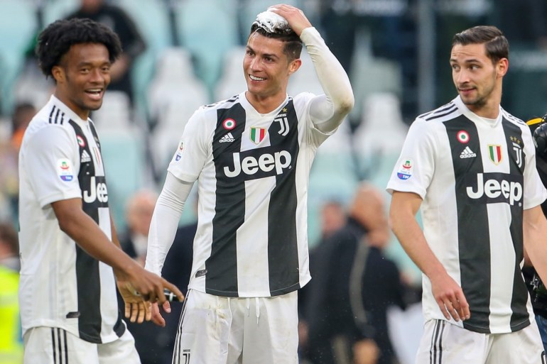 TURIN, ITALY - APRIL 20: Cristiano Ronaldo of Juventus celebrates with his teammates after winning the Italian league at the end of the Serie A match between Juventus and ACF Fiorentina on April 20, 2019 in Turin, Italy. (Photo by Giampiero Sposito/Getty Images)