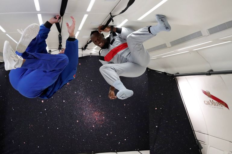 Retired sprinter Usain Bolt and French astronaut Jean-Francois Clervoy, CEO of Novespace, enjoy zero gravity conditions during a flight in a specially modified Airbus Zero-G plane above Reims, France, September 12, 2018. REUTERS/Benoit Tessier