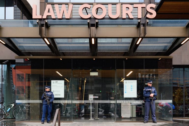 CHRISTCHURCH, NEW ZEALAND - APRIL 05: Armed police officers are seen in front of Christchurch High Court on April 05, 2019 in Christchurch, New Zealand. Accused gunman Brenton Harrison Tarrant is facing 50 murder charges and 39 attempted murder charges after allegedly opening fire at Al Noor Mosque and the Linwood Islamic Centre in Christchurch on March 15. Fifty people were killed, and dozens were injured in what is the worst mass shooting in New Zealand's history. Tarrant will appear via video link from New Zealand's only maximum security prison in Paremoremo, Auckland. Justice Cameron Mander declined all media requests to film or photograph proceedings in court. (Photo by Kai Schwoerer/Getty Images)