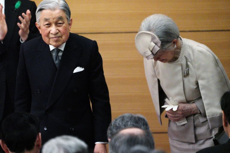 Japan's Emperor Akihito and Empress Michiko greet the guests as they leave from the stage after the awarding ceremony of the Midori Academic Prize Friday, April 26, 2019, in Tokyo. Eugene Hoshiko/Pool via REUTERS