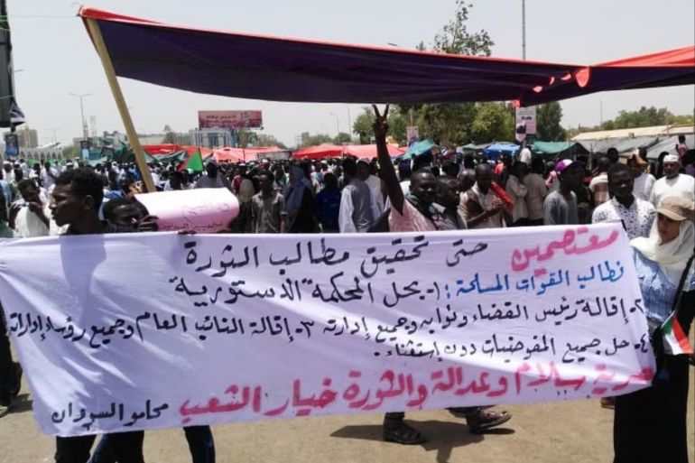 Demonstrations in Sudan- - KHARTOUM, SUDAN - APRIL 12: Sudanese protestors gather in front of central military headquarters demanding a civilian transtion government, in Khartoum, Sudan on April 12, 2019.
