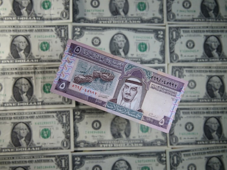 U.S. Dollar and Riyal banknotes are seen in this picture illustration taken May 8, 2017. Picture taken May 8, 2017. REUTERS/Dado Ruvic/Illustration