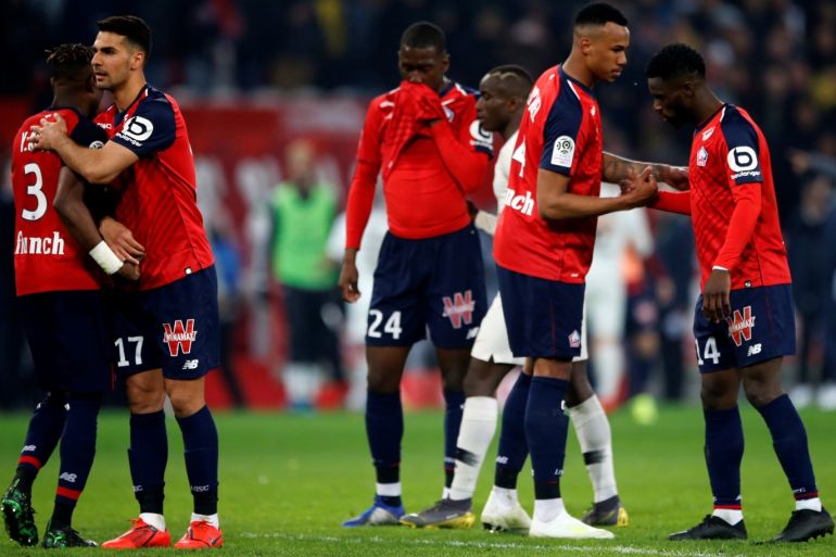 Soccer Football - Ligue 1 - Lille v Paris St Germain - Stade Pierre-Mauroy, Lille, France - April 12, 2019 Lille's Jonathan Bamba, Gabriel and team mates celebrate after the match REUTERS/Pascal Rossignol