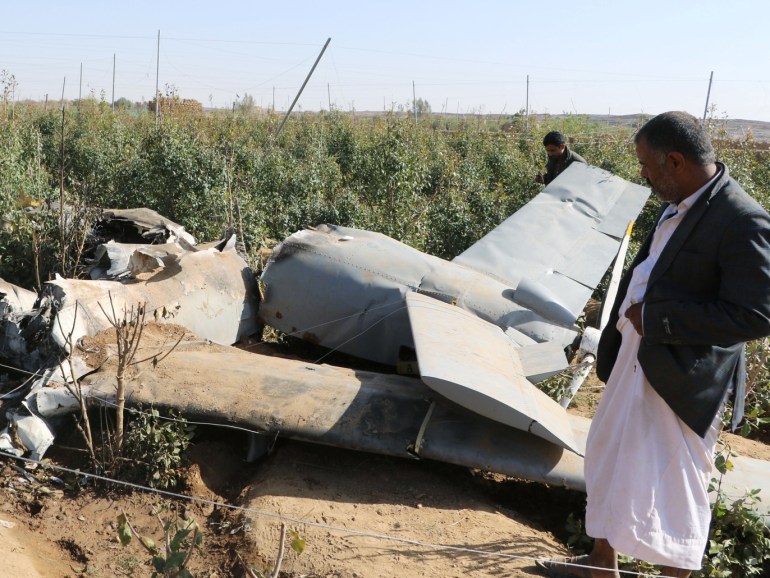 People inspect the wreckage of a drone aircraft that Houthis say they shot down near the northwestern city of Saada, Yemen April 19, 2019. REUTERS/Naif Rahma