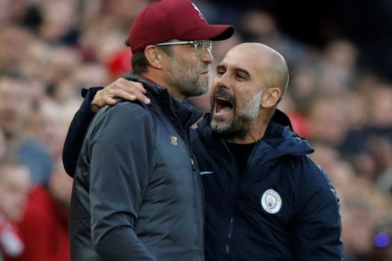 Soccer Football - Premier League - Liverpool v Manchester City - Anfield, Liverpool, Britain - October 7, 2018 Liverpool manager Juergen Klopp with Manchester City manager Pep Guardiola during the match REUTERS/Phil Noble EDITORIAL USE ONLY. No use with unauthorized audio, video, data, fixture lists, club/league logos or