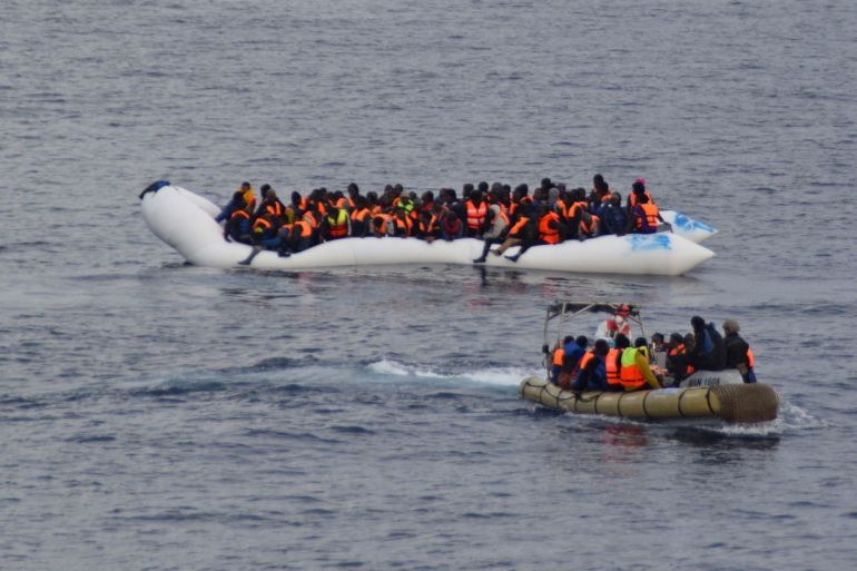 Migrants sit in their boat during a rescue operation of 219 migrants by Italian naval vessel Bettica (not seen) in this February 23 2016 handout picture provided by Marina Militare. More than 700 migrants were rescued from six leaky boats in the sea between Tunisia and Sicily on Tuesday and four were found dead the Italian navy said. REUTERS/Marina Militare/Handout via Reuters ATTENTION EDITORS - THIS PICTURE WAS PROVIDED BY A THIRD PARTY. REUTERS IS UNABLE TO INDEPENDENTLY VERIFY THE AUTHENTICITY CONTENT LOCATION OR DATE OF THIS IMAGE. FOR EDITORIAL USE ONLY. NOT FOR SALE FOR MARKETING OR ADVERTISING CAMPAIGNS. THIS PICTURE IS DISTRIBUTED EXACTLY AS RECEIVED BY REUTERS AS A SERVICE TO CLIENTS.