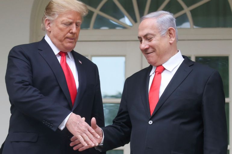 U.S. President Donald Trump and Israel's Prime Minister Benjamin Netanyahu shake hands as they pose on the West Wing colonnade in the Rose Garden during Netanyahu's visit to the White House in Washington, U.S., March 25, 2019. REUTERS/Leah Millis