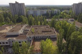PRIPYAT, UKRAINE - AUGUST 19: In this aerial view abandoned buildings stand near the main square in the ghost town of Pripyat not far from the Chernobyl nuclear power plant on August 19, 2017 in Pripyat, Ukraine. On April 26, 1986 reactor number four exploded after a safety test went wrong, spreading radiation over thousands of square kilometers in different directions. The nearby town of Pripyat, which had a population of approxiamtely 40,000 and housed the plant workers and their families, was evacuated and has been abandoned ever since. Today tourists often visit the town on specially-organized tours from Kiev. (Photo by Sean Gallup/Getty Images)