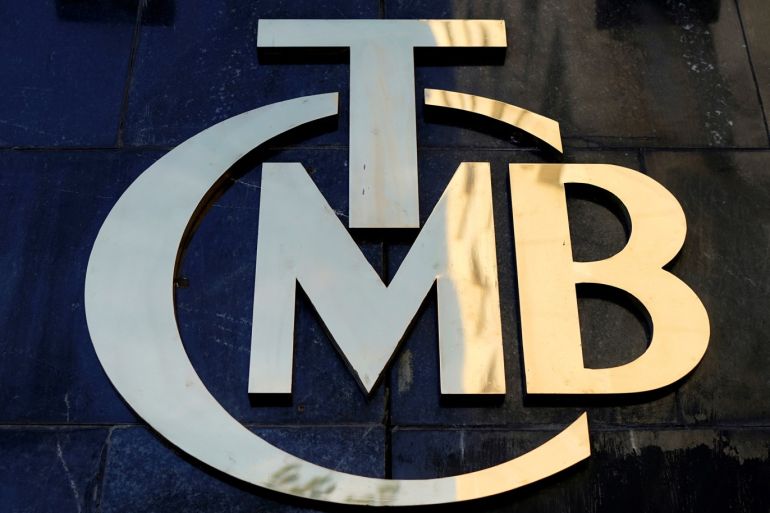 FILE PHOTO: A logo of Turkey's Central Bank (TCMB) is pictured at the entrance of the bank's headquarters in Ankara, Turkey April 19, 2015. REUTERS/Umit Bektas/File Photo