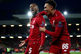 LIVERPOOL, ENGLAND - MAY 07: Georginio Wijnaldum of Liverpool celebrates after scoring his team's third goal with Trent Alexander-Arnold during the UEFA Champions League Semi Final second leg match between Liverpool and Barcelona at Anfield on May 07, 2019 in Liverpool, England. (Photo by Clive Brunskill/Getty Images)