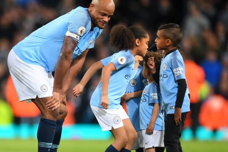 MANCHESTER, ENGLAND - MAY 06: Vincent Kompany of Manchester City celebrates victory with his children during the Premier League match between Manchester City and Leicester City at Etihad Stadium on May 06, 2019 in Manchester, United Kingdom. (Photo by Michael Regan/Getty Images)
