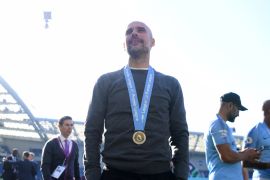 BRIGHTON, ENGLAND - MAY 12: Josep Guardiola, Manager of Manchester City looks on wearing a winners medal after winning the title following the Premier League match between Brighton & Hove Albion and Manchester City at American Express Community Stadium on May 12, 2019 in Brighton, United Kingdom. (Photo by Shaun Botterill/Getty Images)