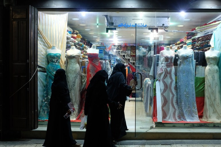 JEDDAH, SAUDI ARABIA - JUNE 23: Women wearing traditional Saudi garments enter a dress shop in Al-Balad district on June 23, 2018 in Jeddah, Saudi Arabia. Jeddah is known as Saudi Arabia's main city for commerce. (Photo by Sean Gallup/Getty Images)
