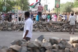 Sudanese protesters walk between barricades erected on roads around the army headquarters in Khartoum, Sudan, 02 May 2019.