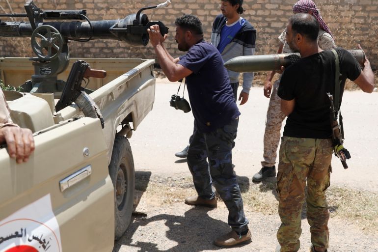 A fighters loyal to Libyan internationally recognised government aims 105 mm cannon durning clashes with forces loyal to Khalifa Haftar outside Tripoli, Libya May 15, 2019. REUTERS/Goran Tomasevic