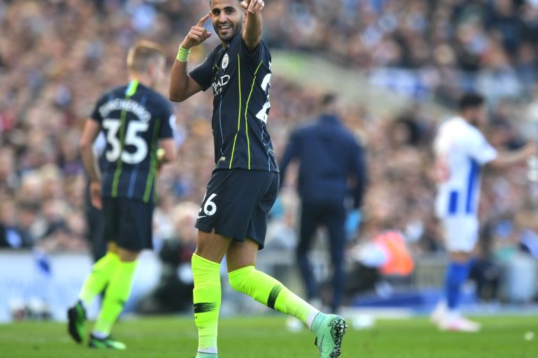 BRIGHTON, ENGLAND - MAY 12: Riyad Mahrez of Manchester City celebrates after scoring his team's third goal during the Premier League match between Brighton & Hove Albion and Manchester City at American Express Community Stadium on May 12, 2019 in Brighton, United Kingdom. (Photo by Michael Regan/Getty Images)