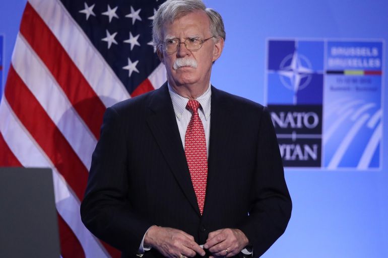 BRUSSELS, BELGIUM - JULY 12: U.S. National Security Advisor John Bolton listens as U.S. President Donald Trump (not pictured) speaks to the media at a press conference on the second day of the 2018 NATO Summit on July 12, 2018 in Brussels, Belgium. Leaders from NATO member and partner states are meeting for a two-day summit, which is being overshadowed by strong demands by U.S. President Trump for most NATO member countries to spend more on defense. (Photo by Sean Gal