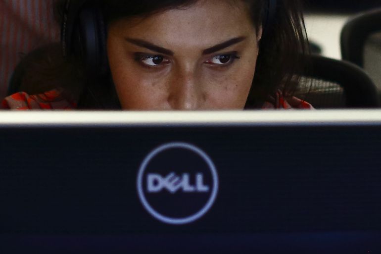 A producer works at a Dell computer in the newsroom at the Al Jazeera America broadcast center in New York, August 20, 2013. Al Jazeera America, a new 24-hour news channel was launched in the United States on Tuesday. REUTERS/Brendan McDermid (UNITED STATES - Tags: MEDIA BUSINESS)