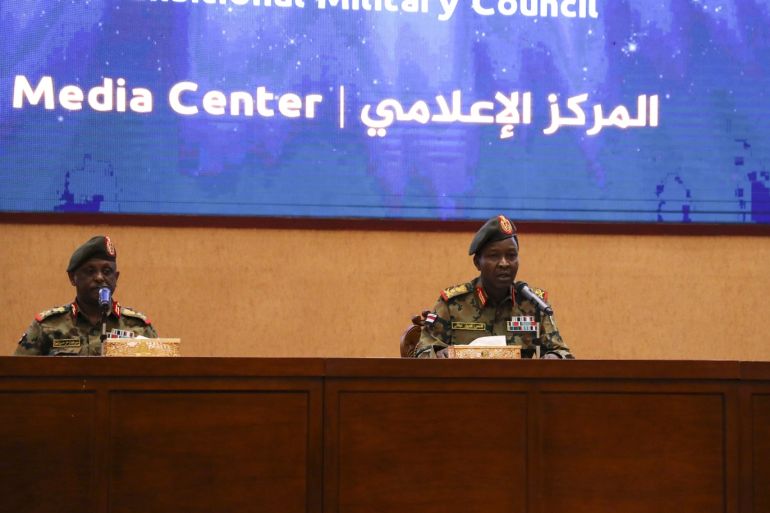 Sudan's ruling Military Council spokesperson Shamseddine Kabbashi- - KHARTOUM, SUDAN - MAY 08: Sudan's ruling Military Council spokesperson Shamseddine Kabbashi (C) makes a speech as he holds a press conference at the Presidential Palace in Khartoum, Sudan on May 08, 2019.