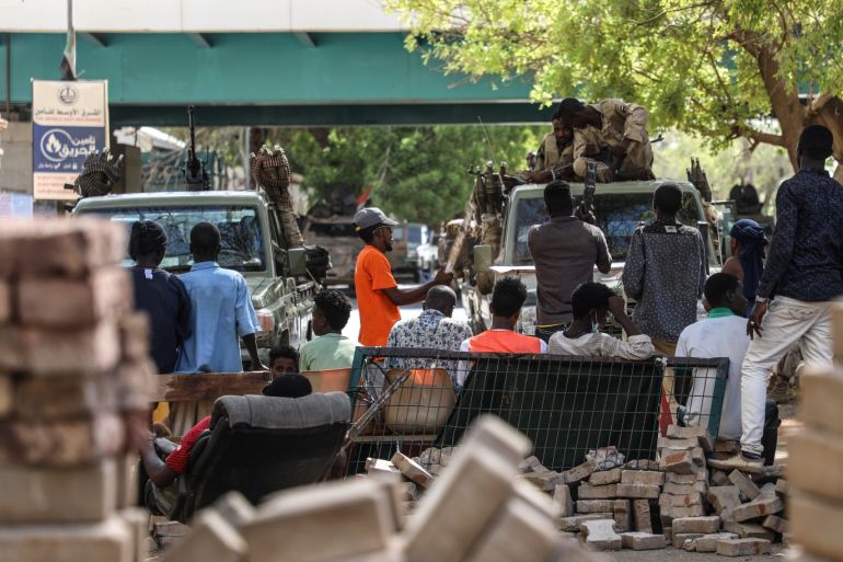 Protest in Sudan- - KHARTOUM, SUDAN - MAY 14 : Sudanese protesters use barricades to block main roads as they gather to protest over killing of protestors in Khartoum, Sudan on May 14, 2019. On Monday, six protesters were shot dead near an ongoing sit-in protest outside army headquarters in Khartoum.