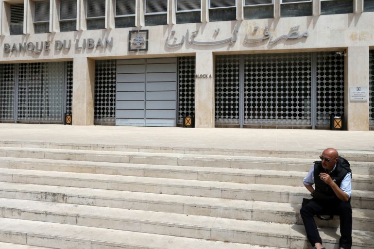 A man sits on the stairs in front of the central bank in Beirut, Lebanon May 7, 2019. REUTERS/Mohamed Azakir