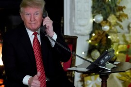 U.S. President Donald Trump participates in NORAD Santa tracker phone calls from the White House in Washington, U.S. December 24, 2018. REUTERS/Jonathan Ernst TPX IMAGES OF THE DAY