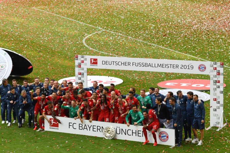 Soccer Football - Bundesliga - Bayern Munich v Eintracht Frankfurt - Allianz Arena, Munich, Germany - May 18, 2019 Bayern Munich celebrate with the trophy after winning the Bundesliga REUTERS/Andreas Gebert DFL regulations prohibit any use of photographs as image sequences and/or quasi-video