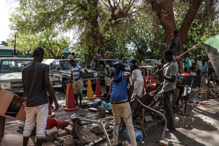 Protest in Sudan- - KHARTOUM, SUDAN - MAY 14 : Sudanese protesters use barricades to block main roads as they gather to protest over killing of protestors in Khartoum, Sudan on May 14, 2019. On Monday, six protesters were shot dead near an ongoing sit-in protest outside army headquarters in Khartoum.