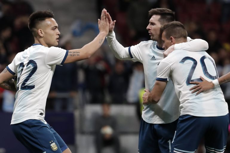 Argentina vs Venezuela : Friendly match- - MADRID, SPAIN - MARCH 22: Lautaro Martinez (L) of Argentina celebrates his goal with Lionel Messi (C) and Giovani Lo Celso (R) during the Friendly match between Argentina and Venezuela at Wanda Metropolitano stadium in Madrid, Spain on March 22, 2019.