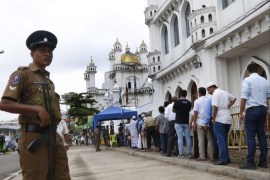 epa07544560 Sri Lankan security forces stand guard while Muslim people queue up for security checking before enter the Friday prayers at Dawatagaha mosque at Town Hall in Colombo, Sri Lanka, 03 May 2019. Security was on high alert in the island after killed at least 259 people and hundreds more injured in a coordinated series of blasts during the Easter Sunday service at churches and hotels on 21 April 2019. EPA-EFE/M.A.PUSHPA KUMARA
