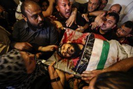Palestinian killed by Israeli attack in Gaza- - BEIT HANOUN, GAZA - MAY 4: (EDITOR'S NOTE: Image depicts death) People carry the dead body of Imad Muhammed Nesir (22), who was killed by Israeli forces' attack to northern Gaza Strip, during a funeral ceremony held in Beit Hanoun, Gaza on May 4, 2019.