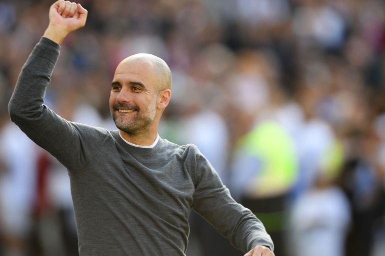BRIGHTON, ENGLAND - MAY 12: Manchester City manager Pep Guardiola salutes the Manchester City fans after the Premier League match between Brighton & Hove Albion and Manchester City at American Express Community Stadium on May 12, 2019 in Brighton, United Kingdom. (Photo by Mike Hewitt/Getty Images)