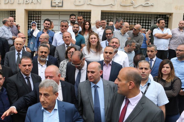 Employees of the Lebanese central bank gather during a strike over state budget proposals that would cut their benefits, in front of the central bank in Beirut, Lebanon May 6, 2019. REUTERS/Mohamed Azakir