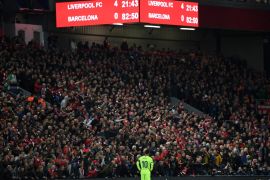 LIVERPOOL, ENGLAND - MAY 07: Lionel Messi of Barcelona looks dejected as the scoreboard reads '4-0' during the UEFA Champions League Semi Final second leg match between Liverpool and Barcelona at Anfield on May 07, 2019 in Liverpool, England. (Photo by Shaun Botterill/Getty Images)