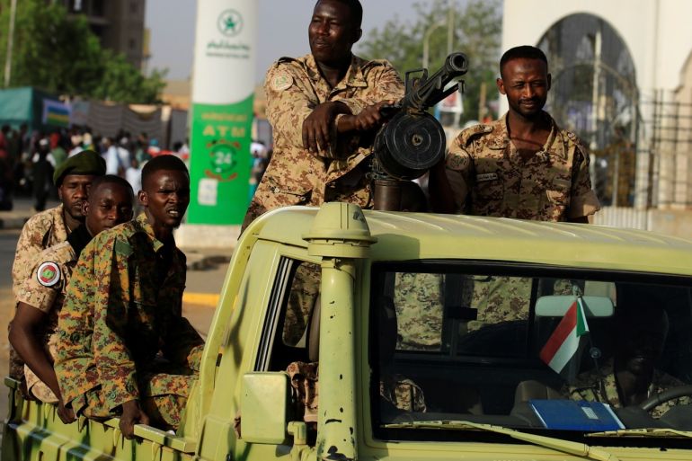 Sudanese soldiers are seen on an army vehicle as they drive through the defense ministry compound in Khartoum, Sudan, May 2, 2019. REUTERS/Umit Bektas