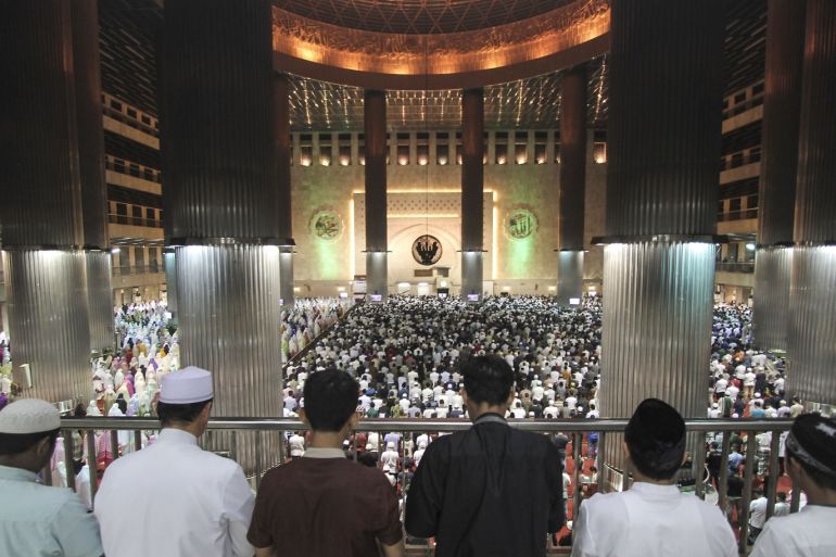 Tarawih prayer in the largest mosque in Southeast Asia- - JAKARTA, INDONESIA - 5 MAY: Muslims in Indonesia perform tarawih prayers on the eve of the holy month of Ramadan at Istiqlal Mosque in Jakarta, Indonesia on May 5, 2019. Istiqlal Mosque has a capacity of 200,000 worshipers making it the largest in Southeast Asia. Based on the outside area of the building and land, the Istiqlal Mosque is also the largest in Southeast Asia and the fourth in the world with an area o