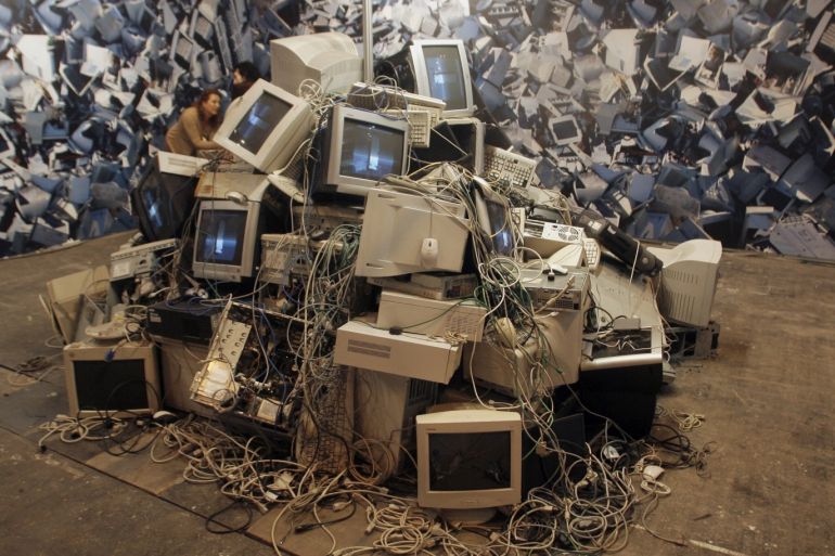 A pile of destroyed desktops and screens are seen in a performance of Spanish Bip-Bip Foundation during the International Telecoms Fair (SIMO) in Madrid November 6, 2007. The foundation is a non-profit organization looking to breach the digital divide between those that have access to new technologies and those that do not. REUTERS/Sergio Perez (SPAIN)