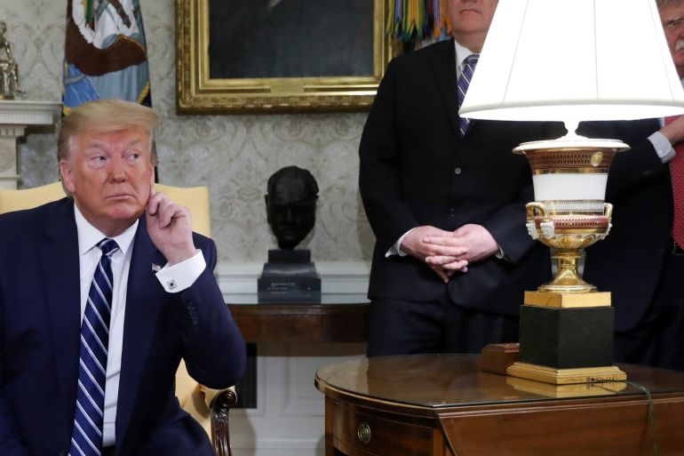 U.S. President Donald Trump listens to questions during a meeting with Canada's Prime Minister Justin Trudeau as Secretary of State Mike Pompeo and White House national security adviser John Bolton look on in the Oval Office of the White House in Washington, U.S., June 20, 2019. REUTERS/Jonathan Ernst