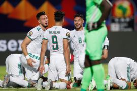 Soccer Football - Africa Cup of Nations 2019 - Group C - Algeria v Kenya - 30 June Stadium, Cairo, Egypt - June 23, 2019 Algeria's Baghdad Bounedjah celebrates scoring their first goal from the penalty spot with Youcef Bela•li and team mates REUTERS/Amr Abdallah Dalsh