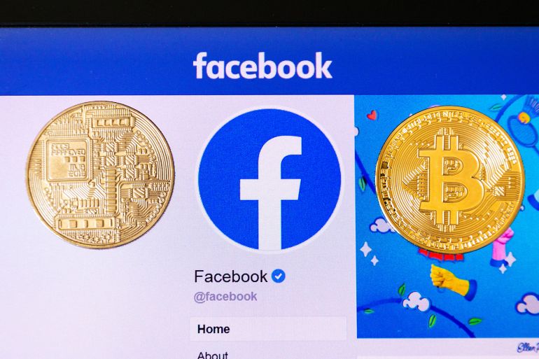 Golden bitcoin lying homepage of Facebook launching digital wallet Calibra and cryptocurrency Libra